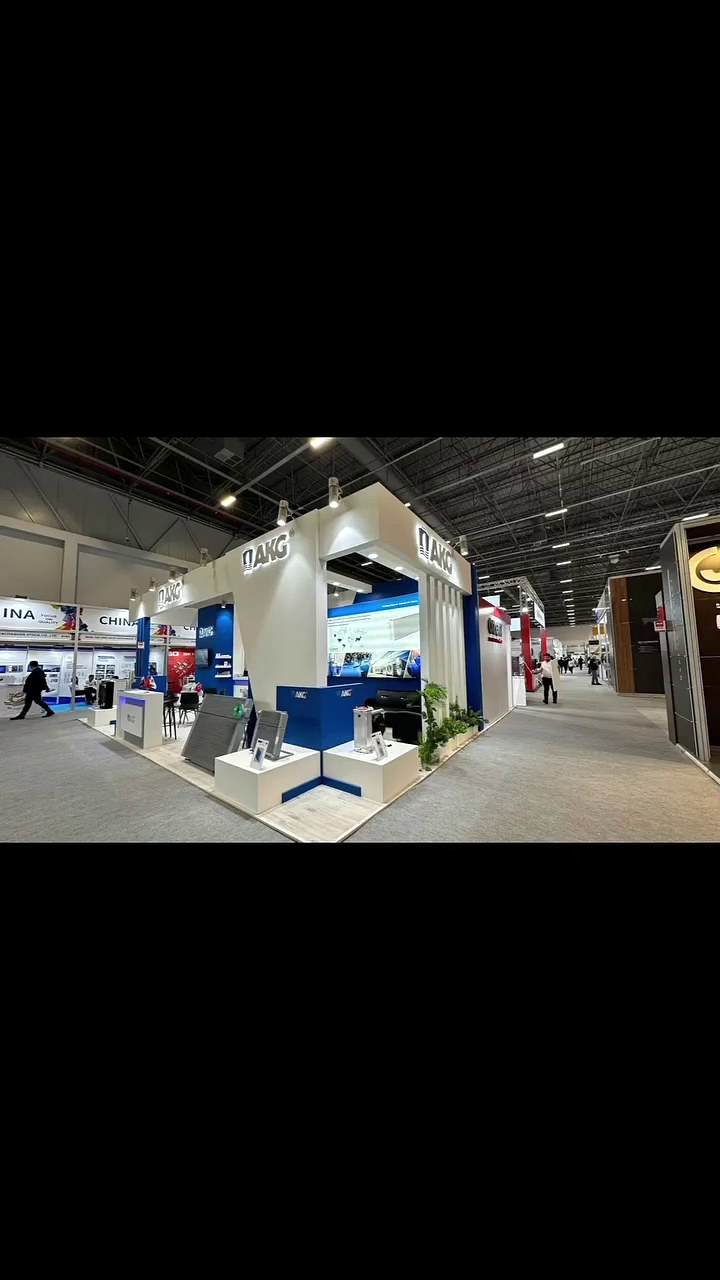 AKG Turkey exhibition stand at WIN Eurasia 2024: A white-and-blue overhead frame, illuminated product displays and open meeting areas make the technical story visible across the hall